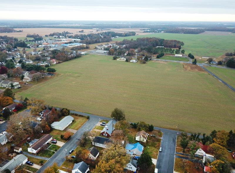 Milton Board of Adjustment unanimously approved a variance for Milton Attainable Housing LLC to have fewer parking spaces than required by code for its proposed Cypress Grove housing project, to be built on the open parcel shown. Developer Preston Schell said the variance would allow for increased green space and less impervious surface. FILE PHOTO