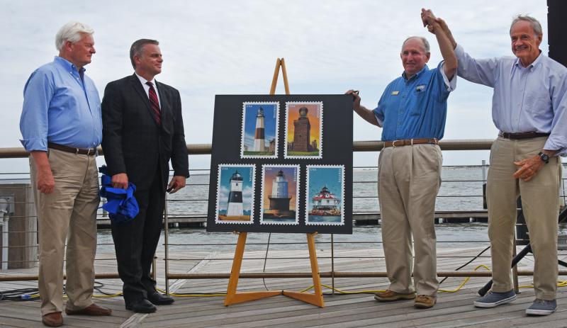 Shown unveiling the stamps are (l-r) Lewes Mayor Ted Becker, USPS District Manager Gary Vaccarella, Delaware River & Bay Lighthouse Foundation Past President Red Moulinier and Sen. Tom Carper. NICK ROTH PHOTOS