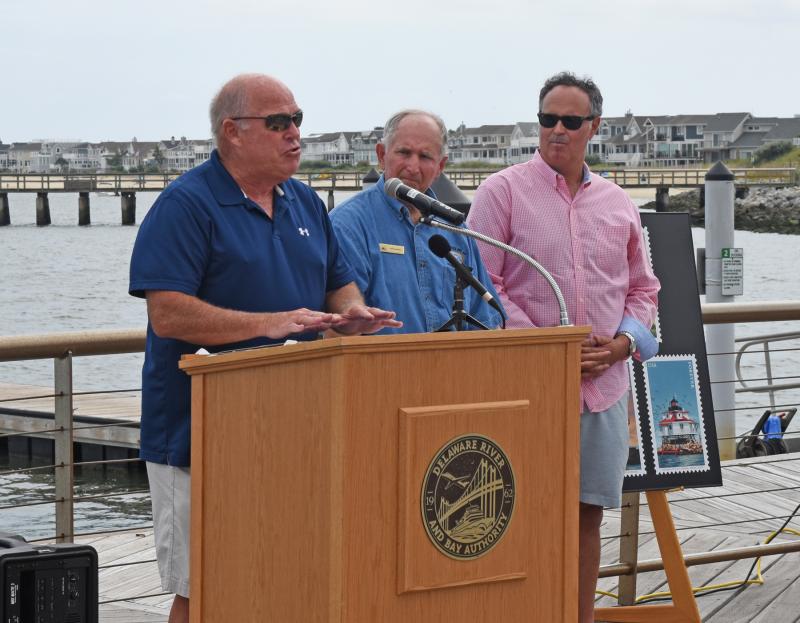 Speaker of the House Rep. Pete Schwartzkopf, D-Rehoboth Beach, left, and Sen. Ernie Lopez, R-Lewes, present a General Assembly tribute to Delaware River & Bay Lighthouse Foundation Past President Red Moulinier, center.