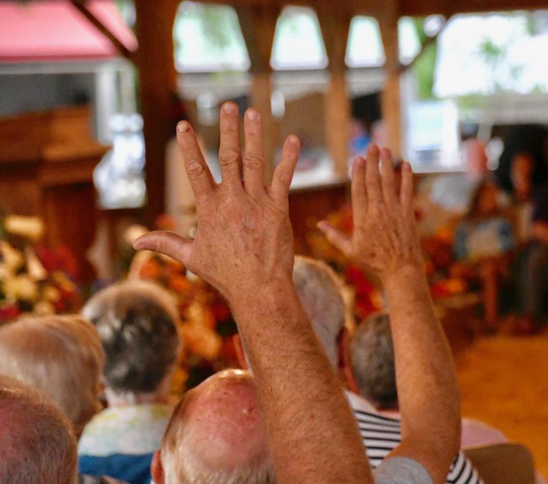 Hands go up to give God reverence and adoration during a service.