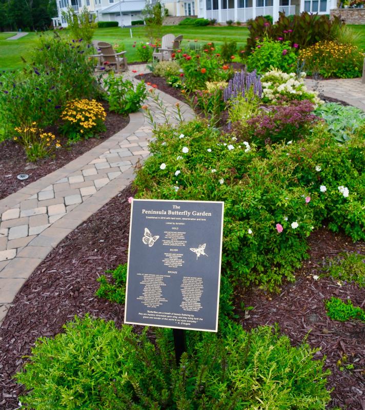 A group of ladies living at The Peninsula has raised funds and done most of the work to create a butterfly garden. A plaque commemorates those who have contributed to the project.
