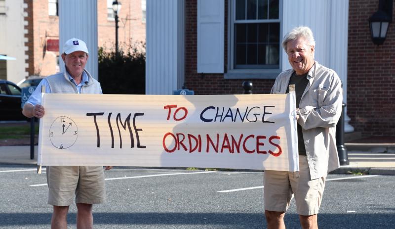 Jeffrey Chandross, left, and Tom Donohoe are among the first to arrive at the protest site in downtown Georgetown.