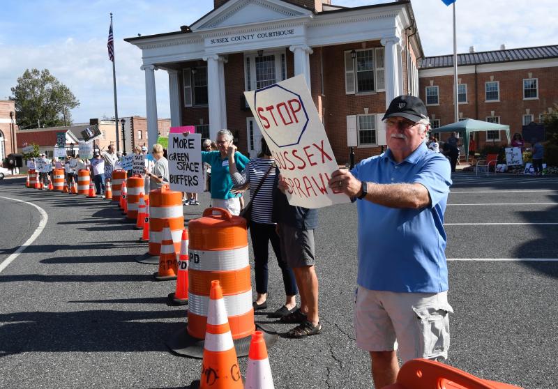 The sign says “Stop Sussex Sprawl,” which is the message the protesters are trying to get across to Sussex County officials.