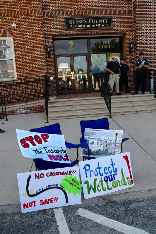 Signs are ready for the taking in front of the Sussex County administrative office building in downtown Georgetown.