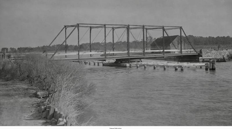 This photo from December 1925 shows the Broadkill River bridge when it was a swing bridge to allow passage of two- and three-masted schooners built in Milton, and sailing in and out of the town. ROYDON L. HAMMOND PHOTO