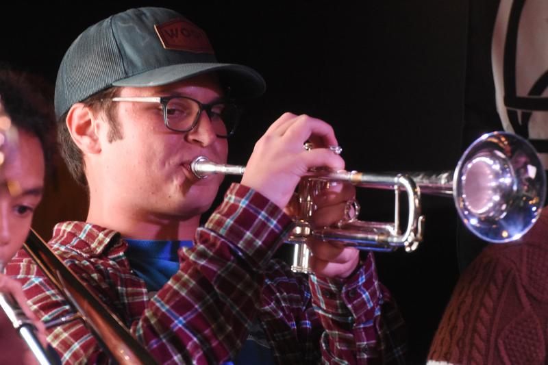 Greg Stewart plays the trumpet with his Dover classmates.