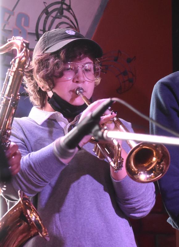 Madison Butler plays a trumpet solo with the Dover band.
