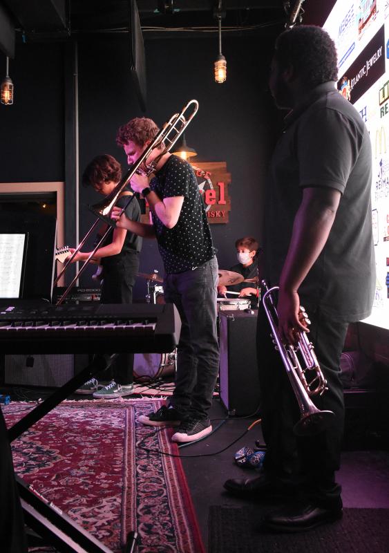Alex Wiggins plays the trombone.
