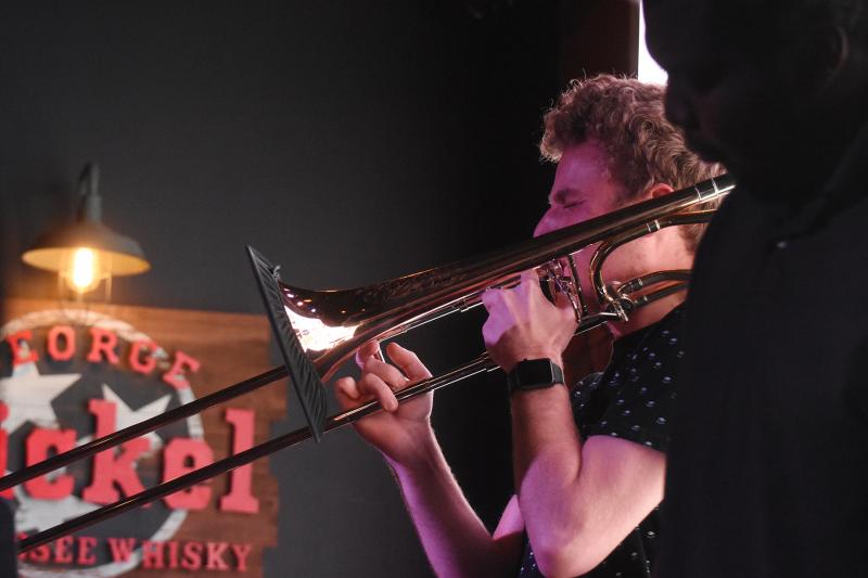 Alex Wiggins feels the music as he plays the trombone.