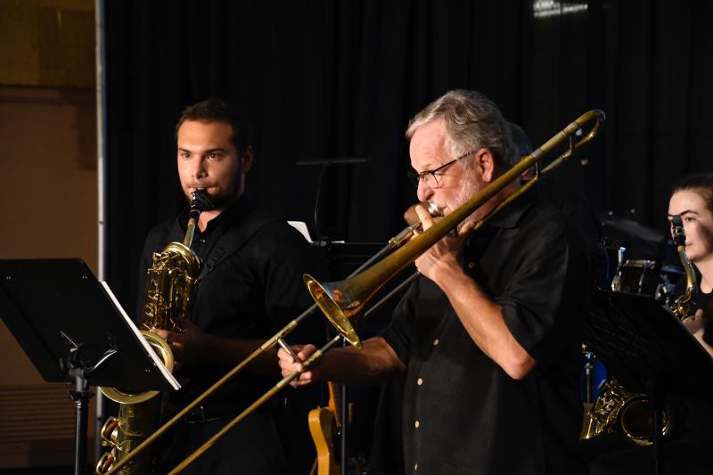 Fred Scott, playing trombone, and Steve Andrewlavage, playing baritone saxophone, take center stage as part of The Spartan Alumni Jazz Band’s performance during the True Blue Jazz Big Band Marathon.