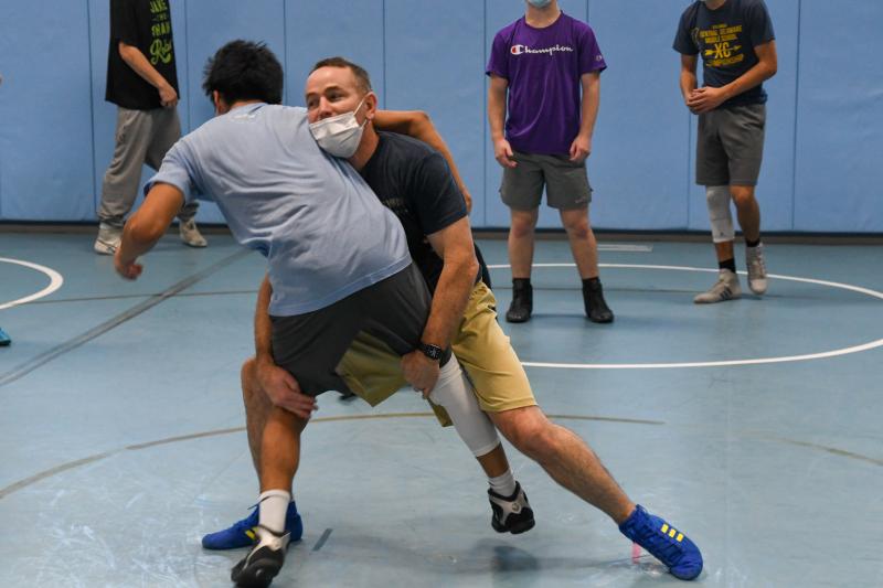 Coach Chris Mattioni busts a move in the wrestling room. DAVE FREDERICK PHOTOS