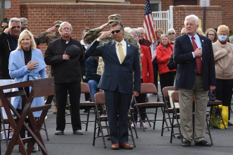 Standing during the singing of the national anthem are (l-r) Lt. Gov. Bethany Hall-Long, Rep. Steve Smyk and Lewes Mayor Ted Becker. NICK ROTH PHOTO