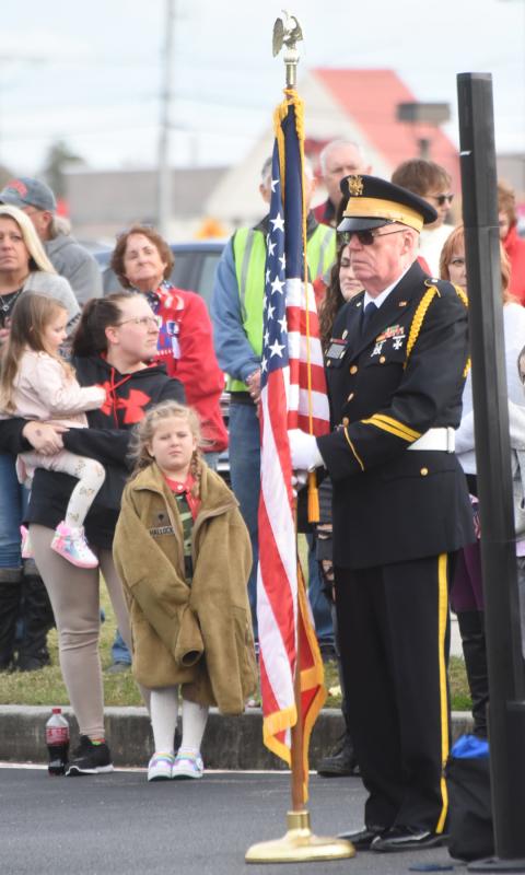 Dick Mansfield of Post 17 stands with the flag throughout the deployment ceremony. NICK ROTH PHOTO