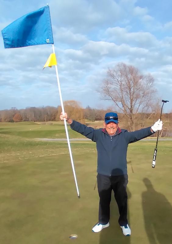 Milton resident Mike Caballero celebrates his very first hole in one, made Dec. 15 on the 17th hole at The Rookery. The 80-year-old Cuban emigre and ex-Marine used his seven iron for the 145-yard shot. SUBMITTED PHOTO