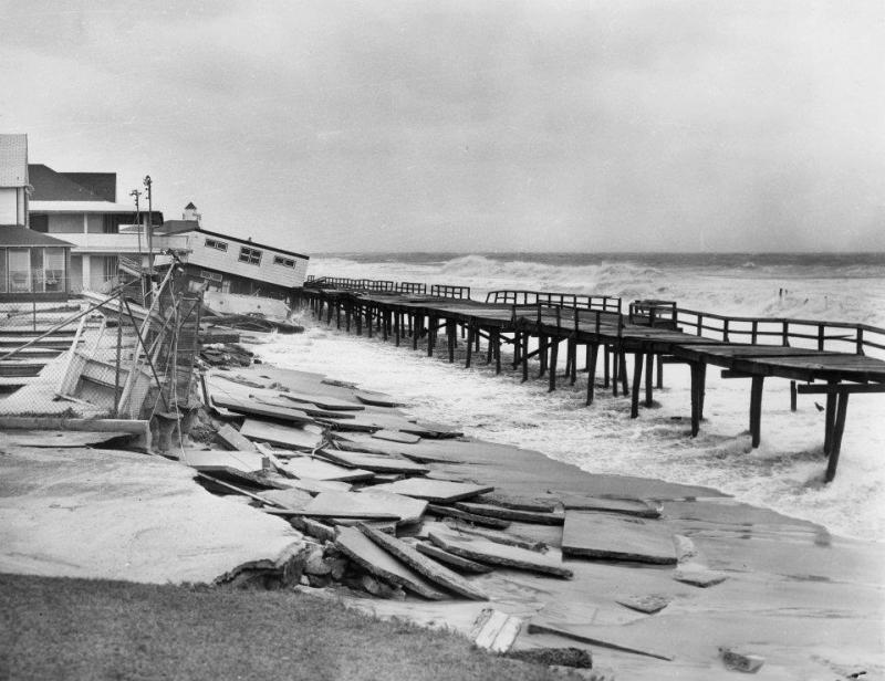 Nearly all of the Rehoboth Beach Boardwalk was destroyed. This section near New Castle Street was the only part with boards still left on the pilings. DELAWARE PUBLIC ARCHIVES PHOTO
