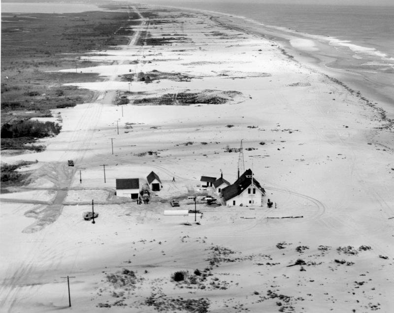 As far as the eye can see, Route 1 – then called Route 14 – is covered with sand washed ashore by an onslaught of waves and high water. The old Indian River Coast Guard station withstood the storm. DELAWARE PUBLIC ARCHIVES PHOTO