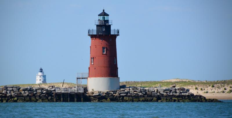 If you find the right spot on the Cape Henlopen State Park fishing pier, you can view both lighthouses and breakwaters from one location. In the foreground is the Delaware Breakwater East End Light, and in the background is the Harbor of Refuge Lighthouse. RON MACARTHUR PHOTOS