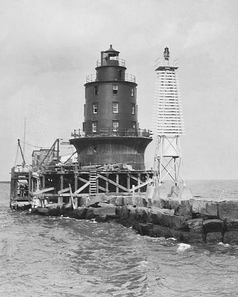 The Harbor of Refuge Lighthouse is under construction on the breakwater in 1928. DELAWARE PUBLIC ARCHIVES PHOTO