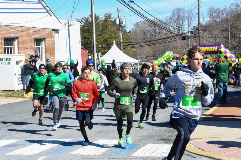 Ryan Baker is chased by the field at the start of the Lucky Leprechaun 5K. DAVE FREDERICK PHOTOS