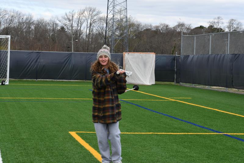 Ella Rishko coaches in a coat.