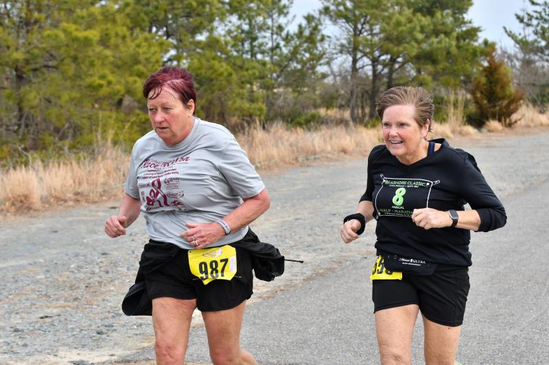 Leeann Waltz and Laurie Milnes finish the 10-miler.
