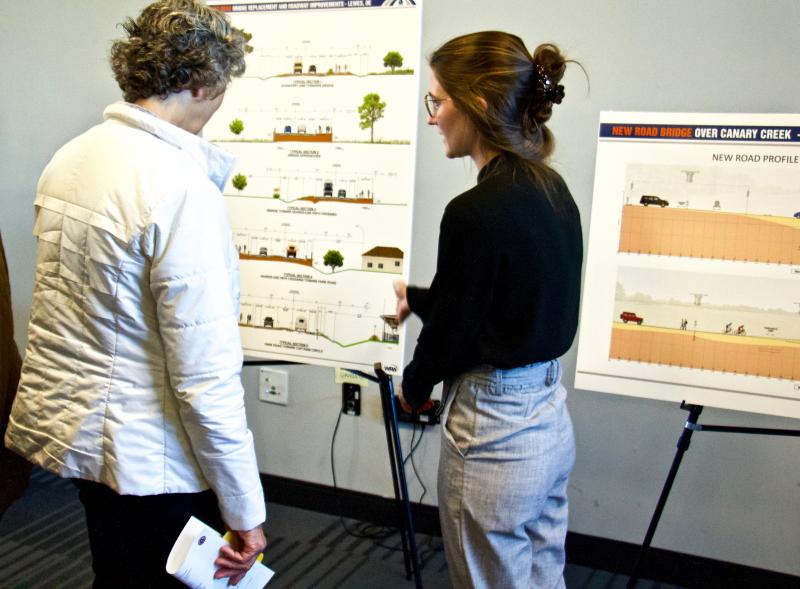 A Whitman, Requardt and Associates representative explains the design and 100-year floodplain level to resident Marta Nammack. AARON MUSHRUSH PHOTOS