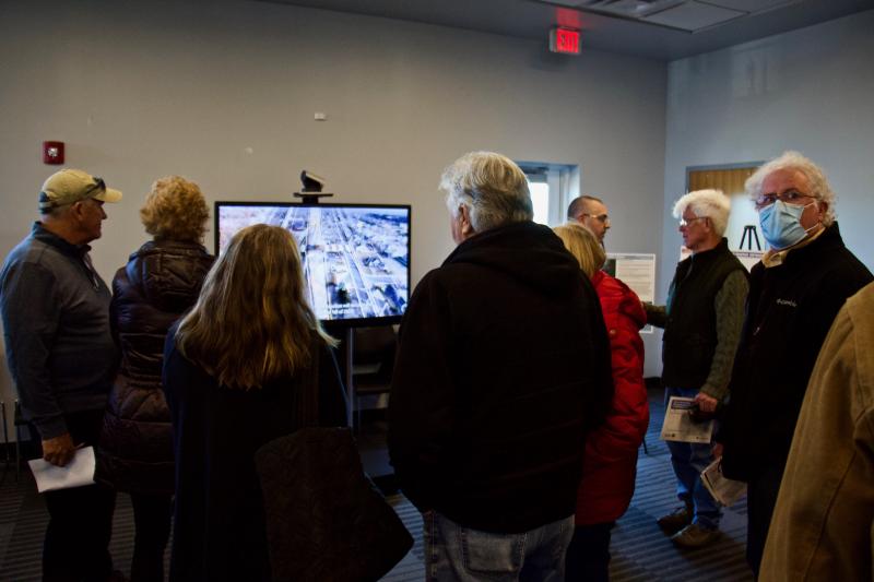 Attendees watch a video about the highly detailed bridge replacement project.