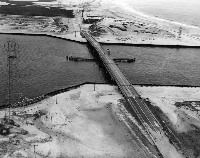 Although the roadway was covered with sand, the Indian River Inlet bridge remained intact. DELAWARE PUBLIC ARCHIVES PHOTO