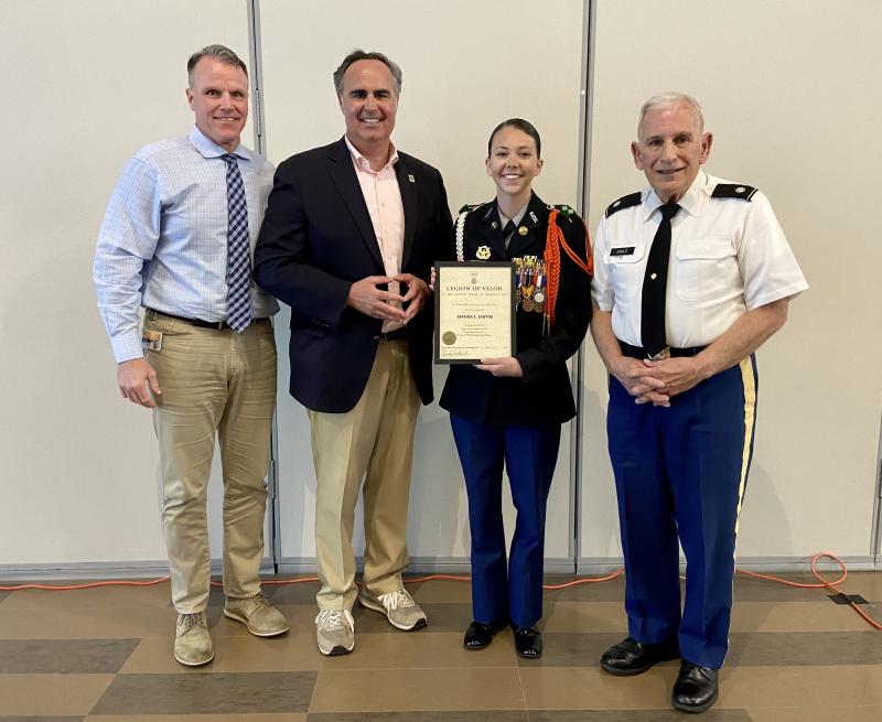 Cape High JROTC Battalion Commander Marina Santini received the Legion of Valor Bronze Cross for outstanding achievement. Gathered at the award ceremony April 28 are (l-r) Superintendent Bob Fulton; Sen. Ernie Lopez, R-Lewes; Marina Santini; and Lt. Col. Ronald Erale. ELLEN DRISCOLL PHOTOS