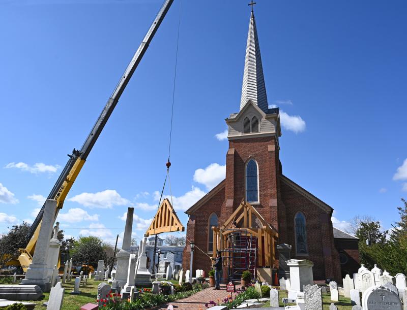 A piece of the portico slowly makes its way to the front of the church.