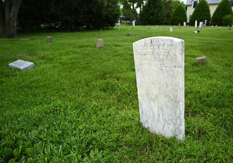 Pam Brown and Dawnel White have identified more than 200 people interred in the St. George AME cemetery on Pilottown Road. Shown is the headstone for George Riley, who died in 1858 and has at least 30 relatives also buried in the cemetery. NICK ROTH PHOTOS