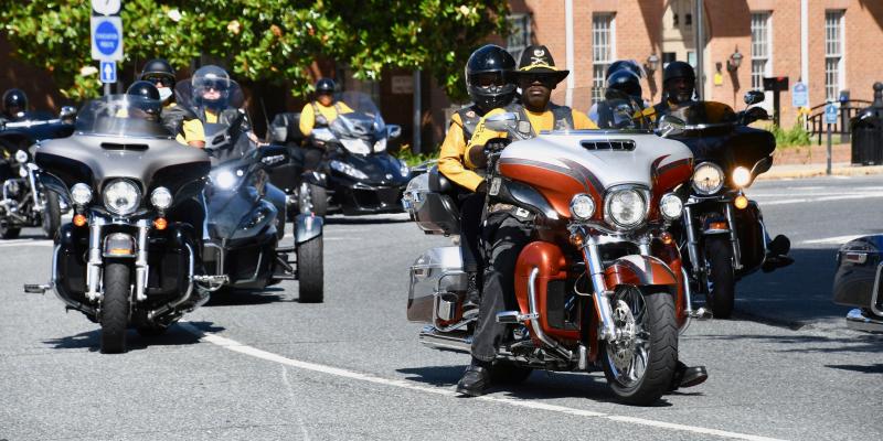 Members of the Buffalo Soldiers Motorcycle Club lead the way in the Juneteenth parade around The Circle in Georgetown.