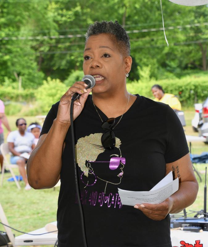 Melinda Hudson leads the singing of “Lift Every Voice” to start the celebration.