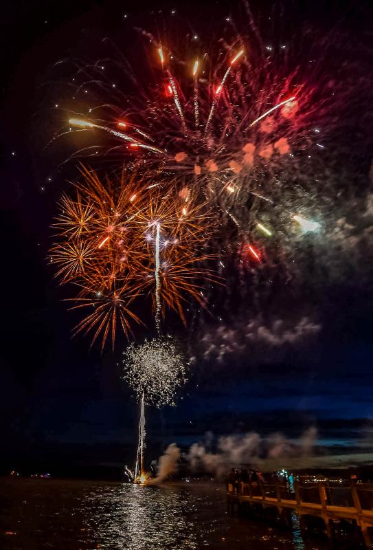 Fireworks light the sky over the bay at Dewey.