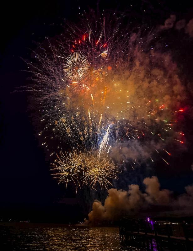 Fireworks propel from the barge off Northbeach.