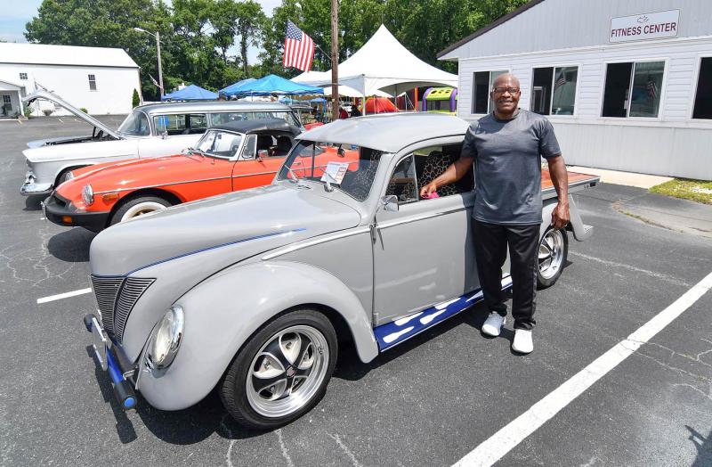 Grady Chandler stands with his 1963 VW pickup.