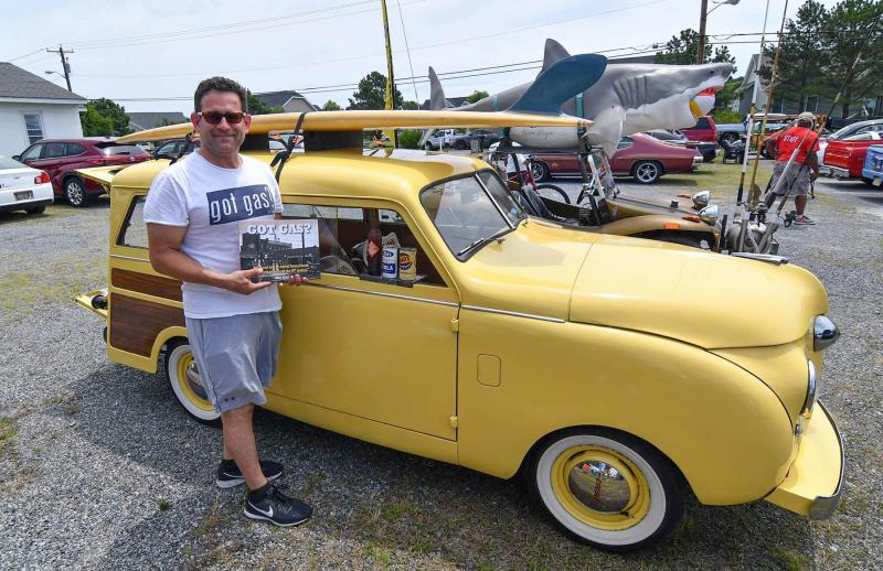 Jimmy Rosen displays his book “Got Gas,” a pictorial look at Central Pennsylvania service stations from the 20th century. His car, a 1948 Crosley Woody wagon, was a restored four-cylinder beach wagon that could be repaired in appliance stores.