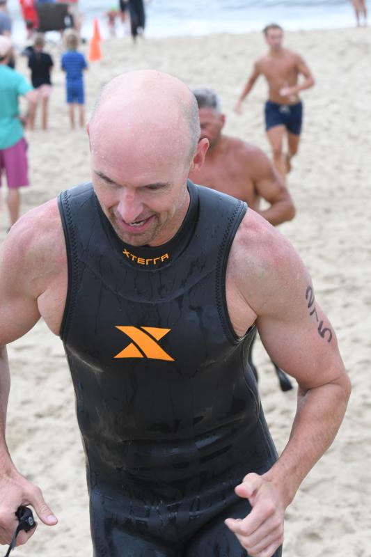 Troy Bokius leaves the beach after the swim.