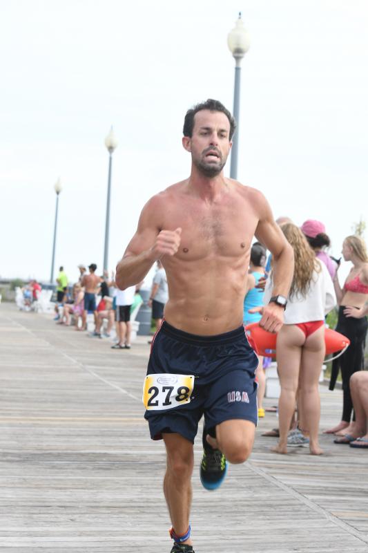 Bryan Mack competed as a relay runner.
