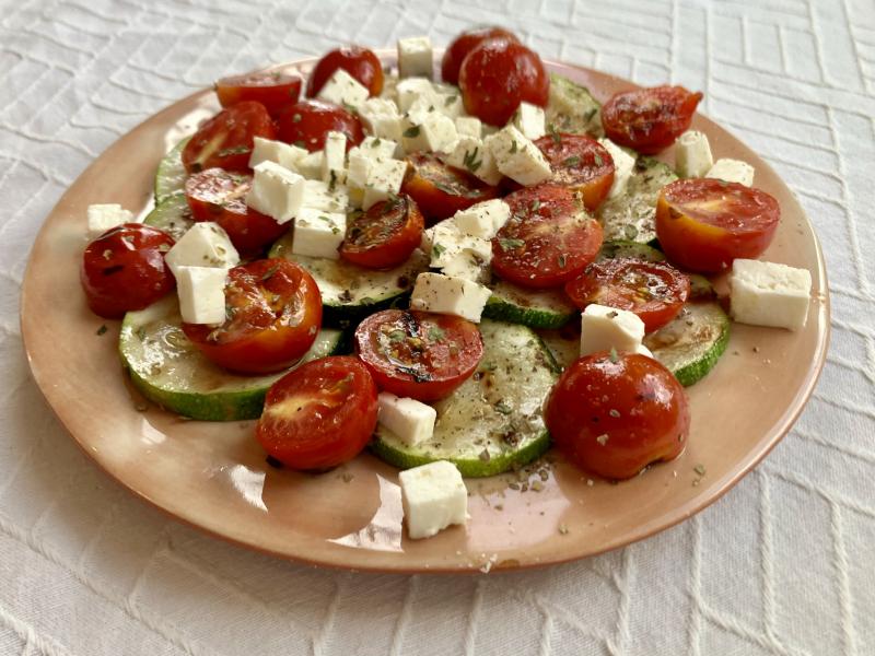 Grilled zucchini and cherry tomatoes accompanied by chunks of feta cheese create a bright summer feast for the eyes and the palate. JACK CLEMONS PHOTO