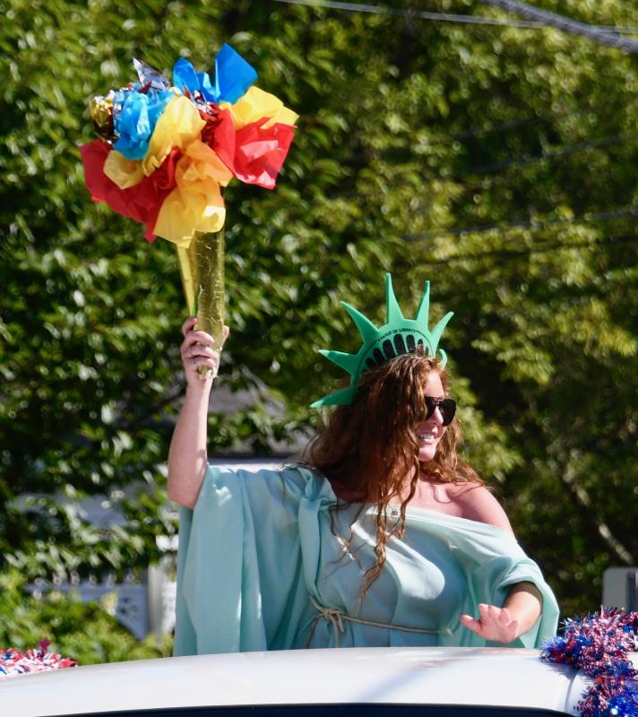 Lady Liberty Julie Sing smiles at the large crowd gathered for the Doo-Dah Parade.