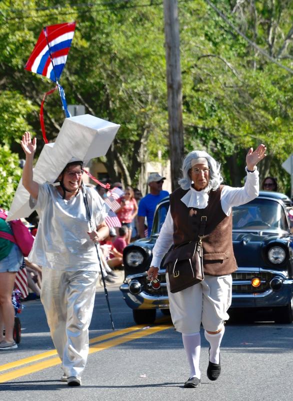 Only during a Doo-Dah Parade can you find Hilda Adams, left, as a lightning bolt, and Lori Soligo as Ben Franklin.