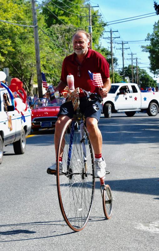 Tom Hartley of Lewes has perfect balance as he pedals an antique bicycle along the parade route.