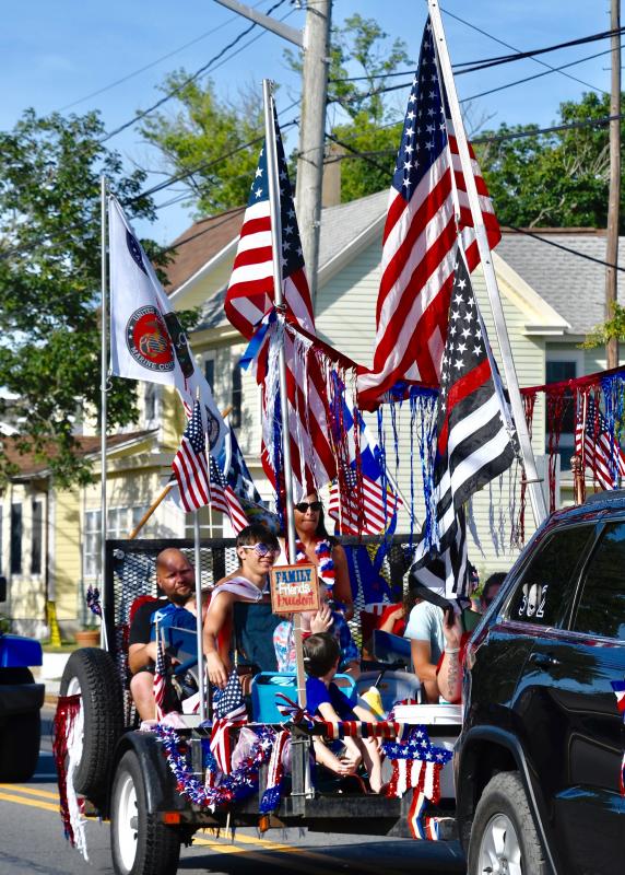 All it takes is a lot of flags to take part in the annual Doo-Dah Parade.