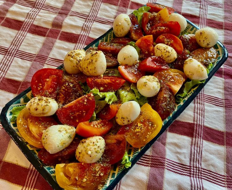 Pack your own spice blend for a quick vinaigrette to enhance a simple tomato and mozzarella salad made with fresh farmers market finds on your vacation trip. JACK CLEMONS PHOTO