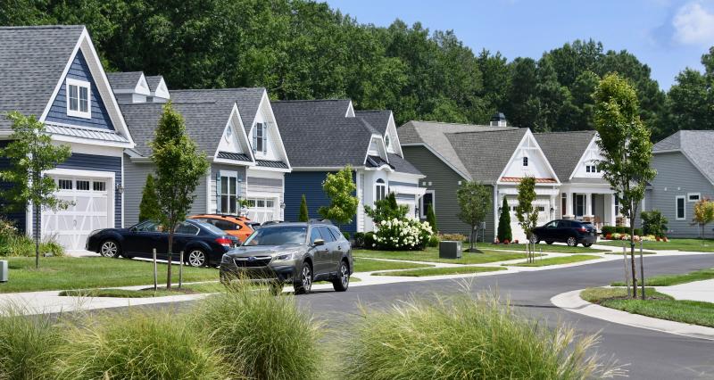 One of the streets in the Saddle Ridge subdivision would border the property line of the proposed 84-unit project. The plan includes a buffer of existing trees between the two communities and a two-acre section of wetlands. RON MACARTHUR PHOTO