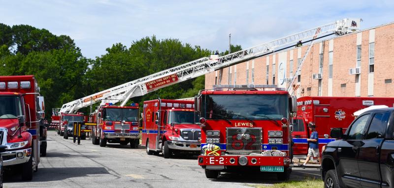 Many of the Lewes Fire Department’s engines, trucks and ambulances are parked in front of the former Shields Elementary School off Savannah Road to use during an Aug. 6 training exercise. Another took place Aug. 9. RON MACARTHUR PHOTOS