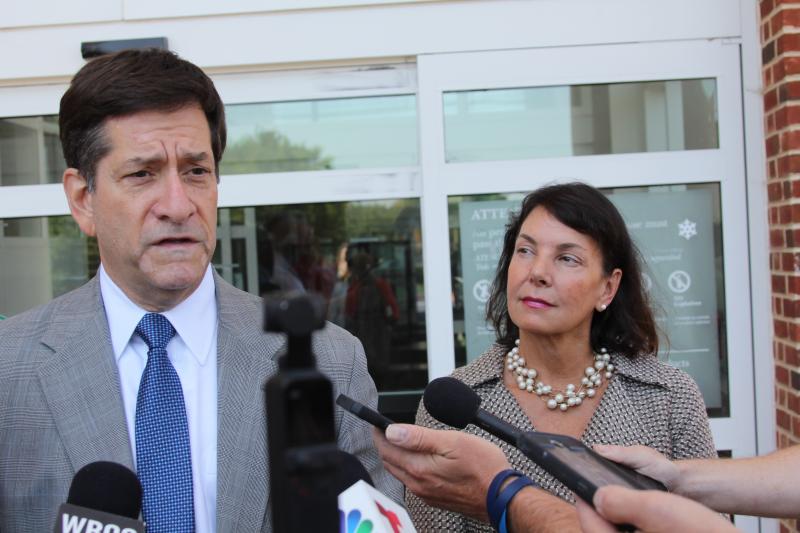 Defense attorney Steve Wood and State Auditor Kathleen McGuiness speak to reporters after the jury verdict July 1. MELISSA STEELE PHOTO