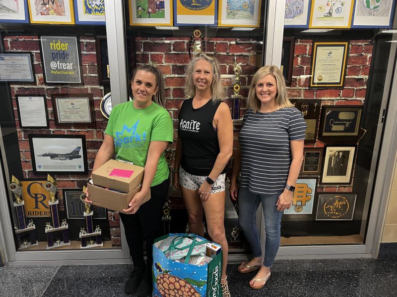 Gathered to drop off donated supplies at W. B. Simpson Elementary School in Camden/Wyoming are (l-r) Ashly Gray, Kathy De Angelis and Katrina Custer. SUBMITTED PHOTO