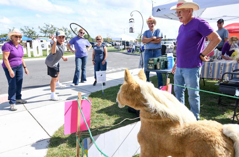Matthew Westcott tosses a ring around the horse’s neck at the Grace Church.